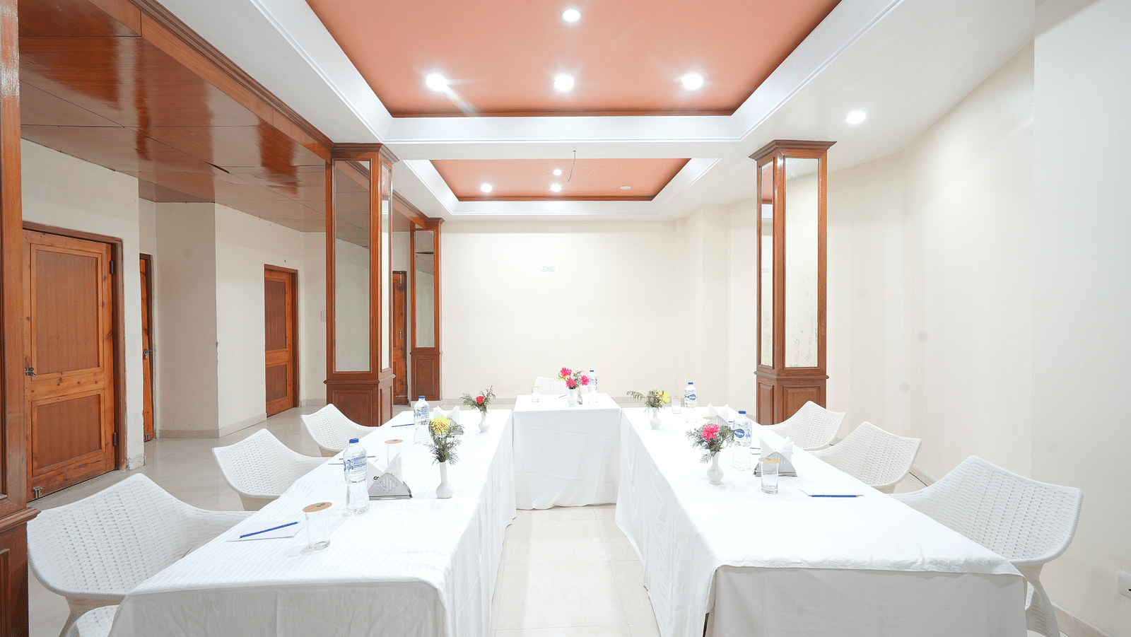 Conference hall with chairs and tables neatly arranged at DLS Hotels The Rock Castle.